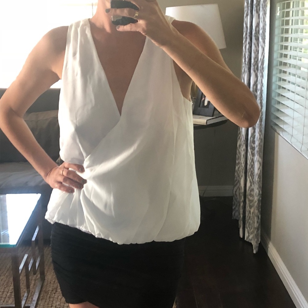 White sleeveless blouse
